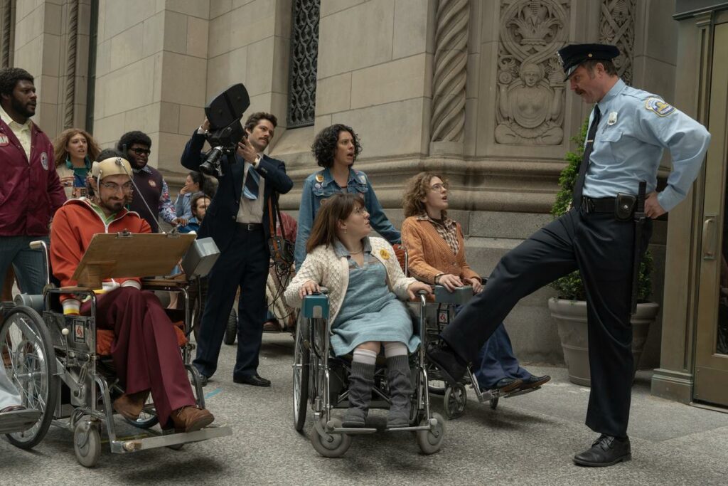 Andrew Pilkington, Siena Rafter, Charlie Rush-Reese, Dylan O’Brien, Roberta Colindrez, Ruth Madeley, and Madeline Delp in Apple's Being Heumann.